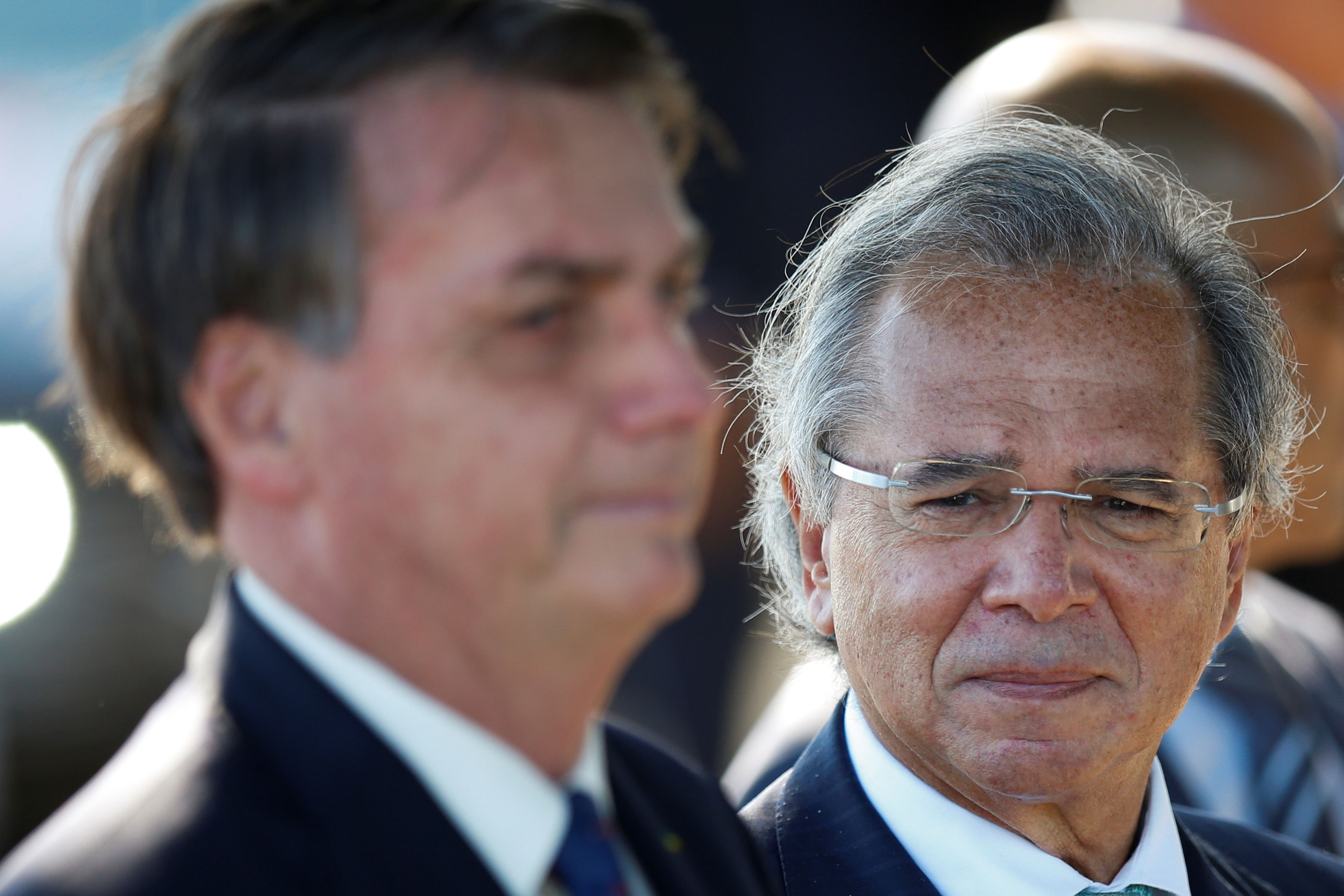 O ministro da Economia, Paulo Guedes, ao lado do presidente Jair Bolsonaro