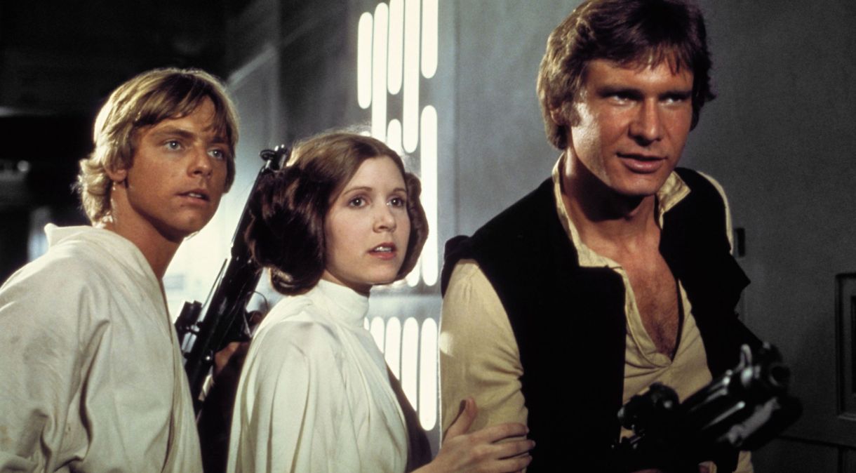 Mark Hamill, Carrie Fisher e Harrison Ford em Star Wars, episódio 4, em 1977