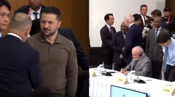 Transmissão oficial do evento mostra líderes se movendo para recepcionar Zelensky; Lula estava sentado à mesa, lendo um documento