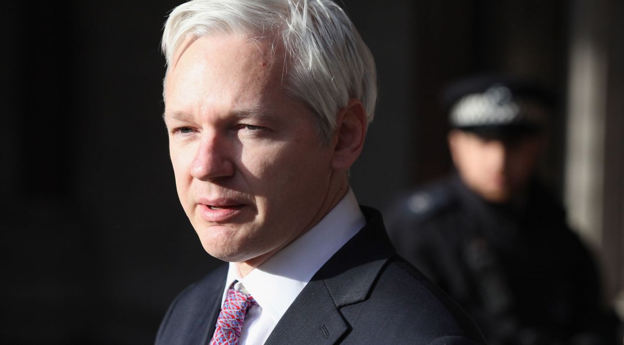 LONDON, ENGLAND - DECEMBER 05: Julian Assange, the founder of the whistle-blowing 'WikiLeaks,' leaves the High Court after winning the right to petition the UK Supreme Court to review his extradition to Sweden on December 5, 2011 in London, England. Last month Mr Assange lost a High Court challenge to his extradition to Sweden where he is due to face charges of sex offences. (Photo by Oli Scarff/Getty Images)